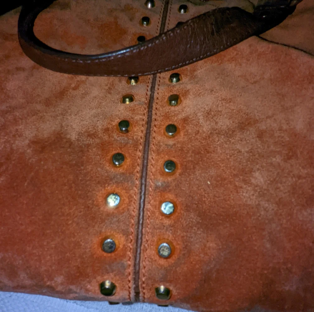 Michael Kors orange suede studded slouchy shoulder bag.